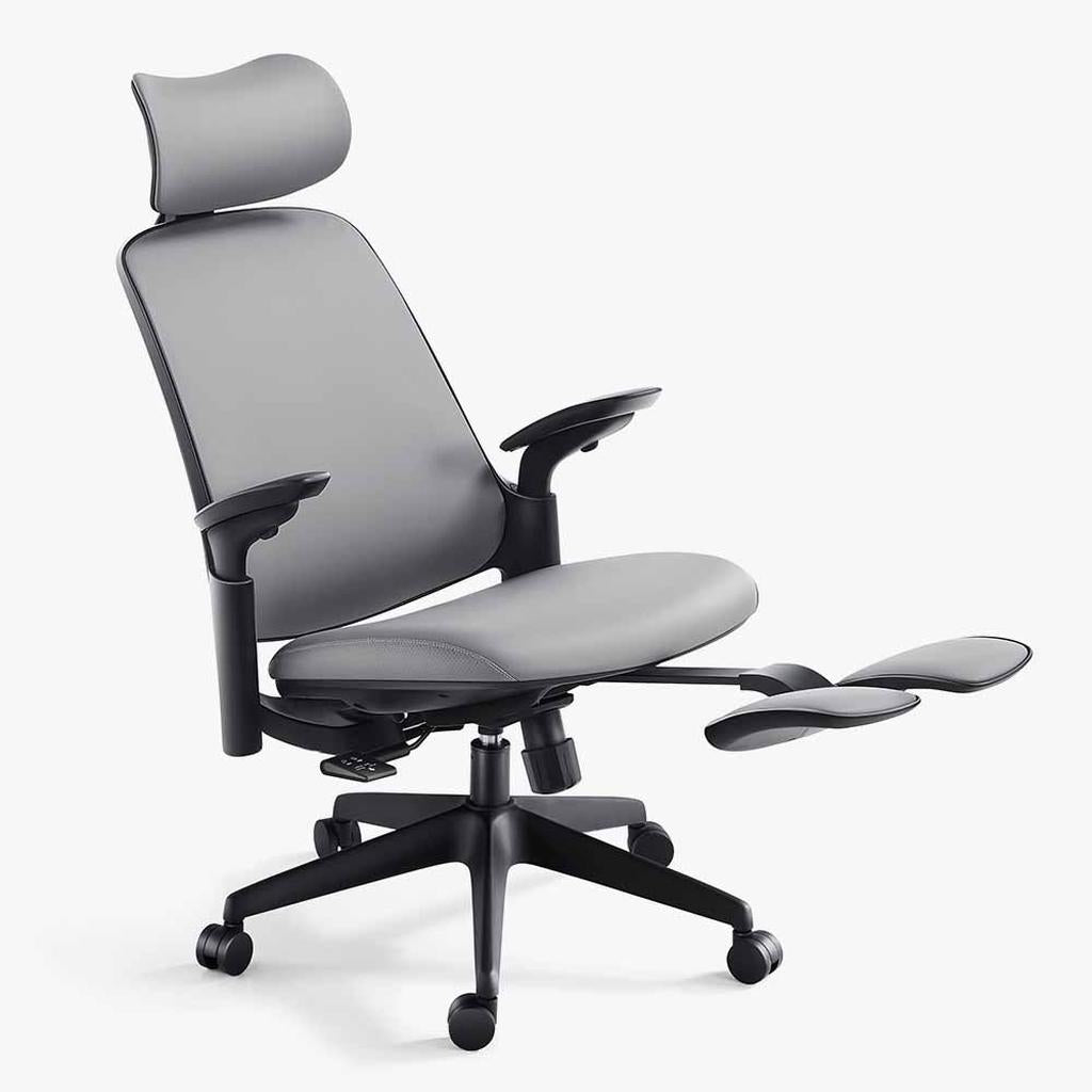 grey ergonomic leather chair with black frame and footrest