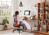 Comfortable home office chair with lumbar support - Orange Voyager used by a model